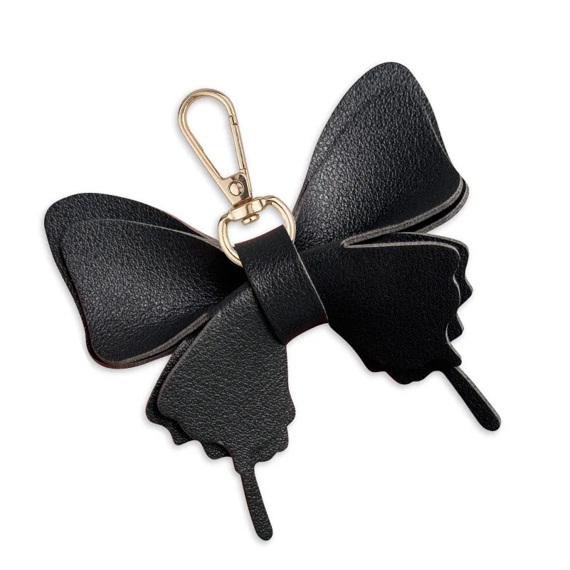 Niedlicher Taschenanhänger, Schlüsselanhänger in Gold mit Schmetterling-Anhänger