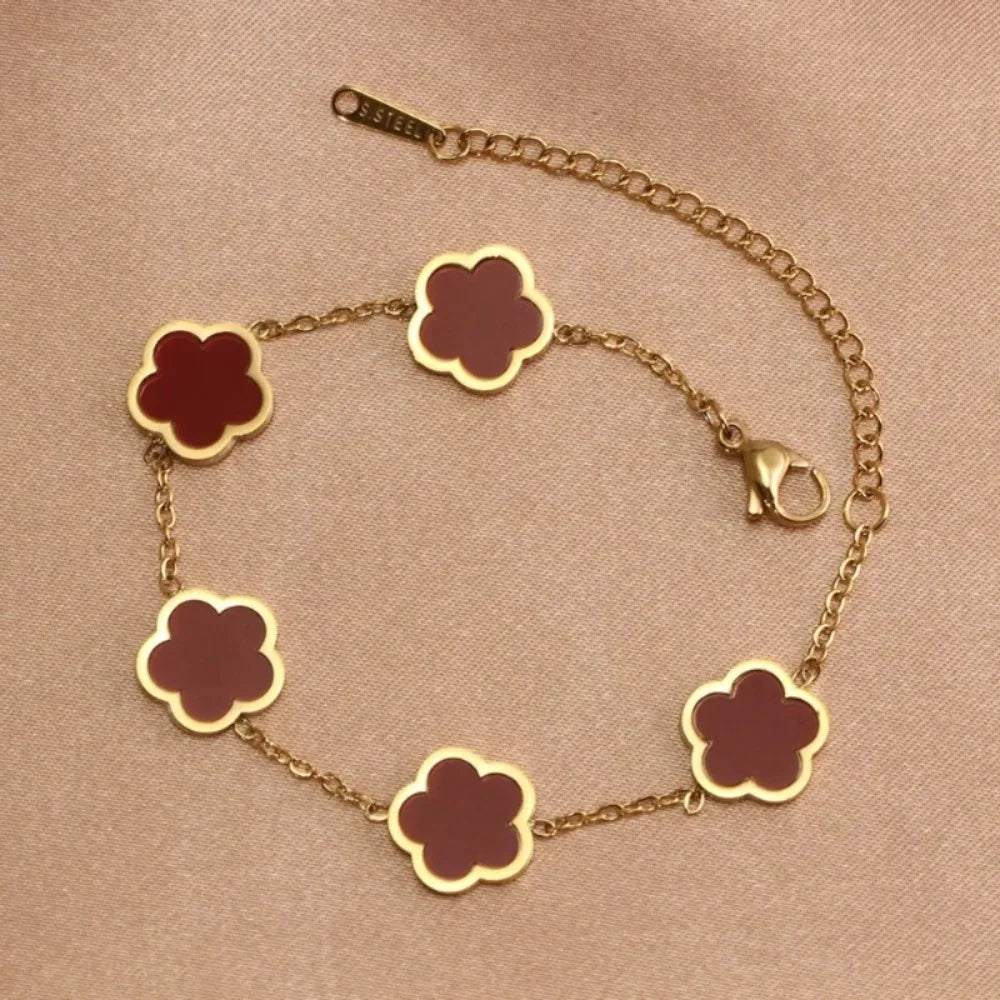 Elegante Armkette/ Armband in Gold, mit verschiedenfarbigen Blumen