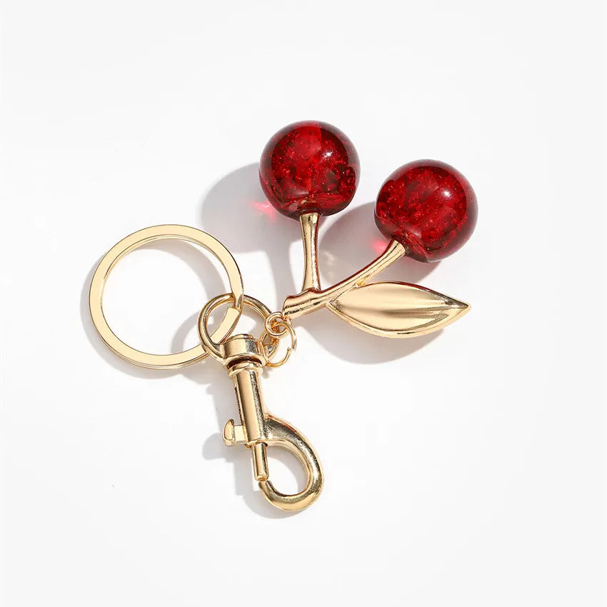 Niedlicher Taschenanhänger, Accessoire in Gold mit Kirsch - Anhänger