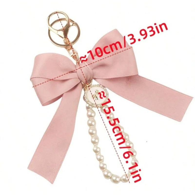 Niedlicher Taschenanhänger, Accessoire in Gold mit Schleifen - Anhänger