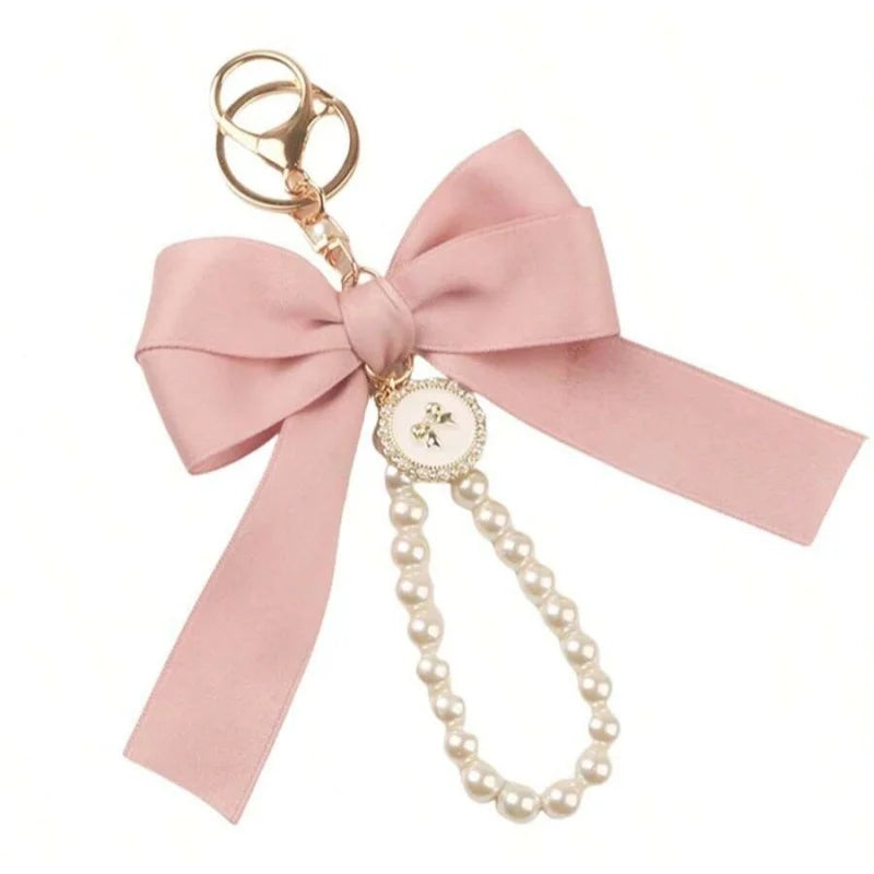 Niedlicher Taschenanhänger, Accessoire in Gold mit Schleifen - Anhänger