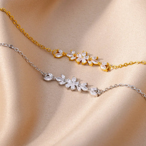 Elegante Armkette/ Armband in Gold und Silber mit Blumen/Steinen