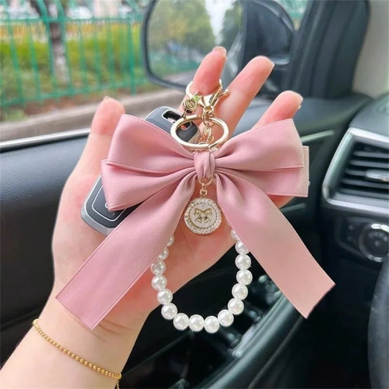 Niedlicher Taschenanhänger, Accessoire in Gold mit Schleifen - Anhänger