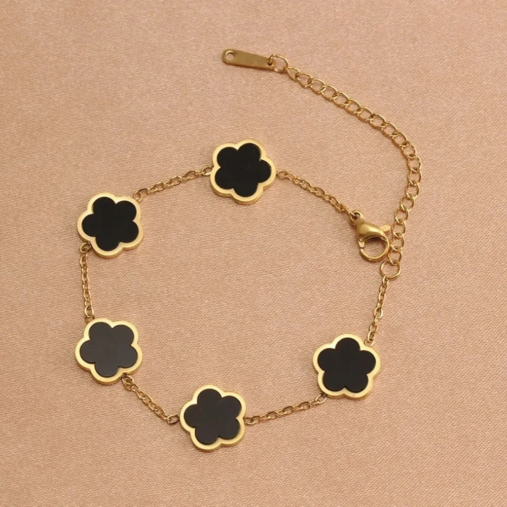 Elegante Armkette/ Armband in Gold, mit verschiedenfarbigen Blumen